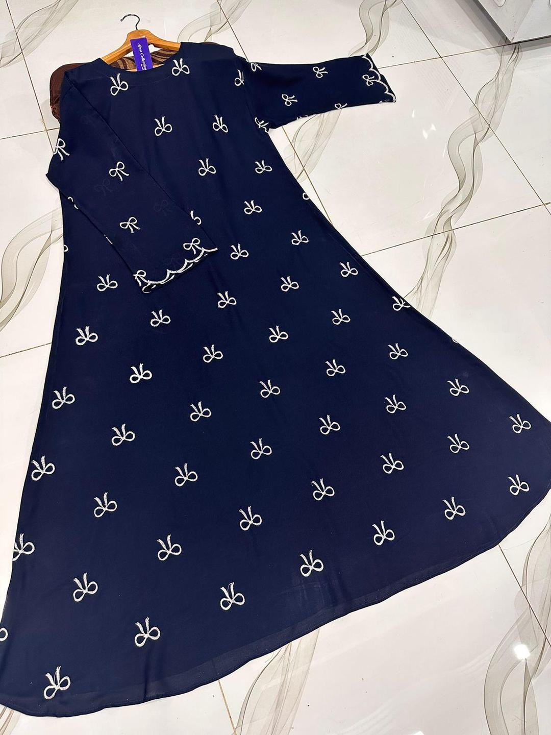 2025/07/1c69b63e-af13-4ae0-bae9-ba08302d5761.jpeg Georgette Embroidered Bow Abaya | Classic Flared Abaya for Women in Maroon, Blue & Black – Husnezara - Image 2